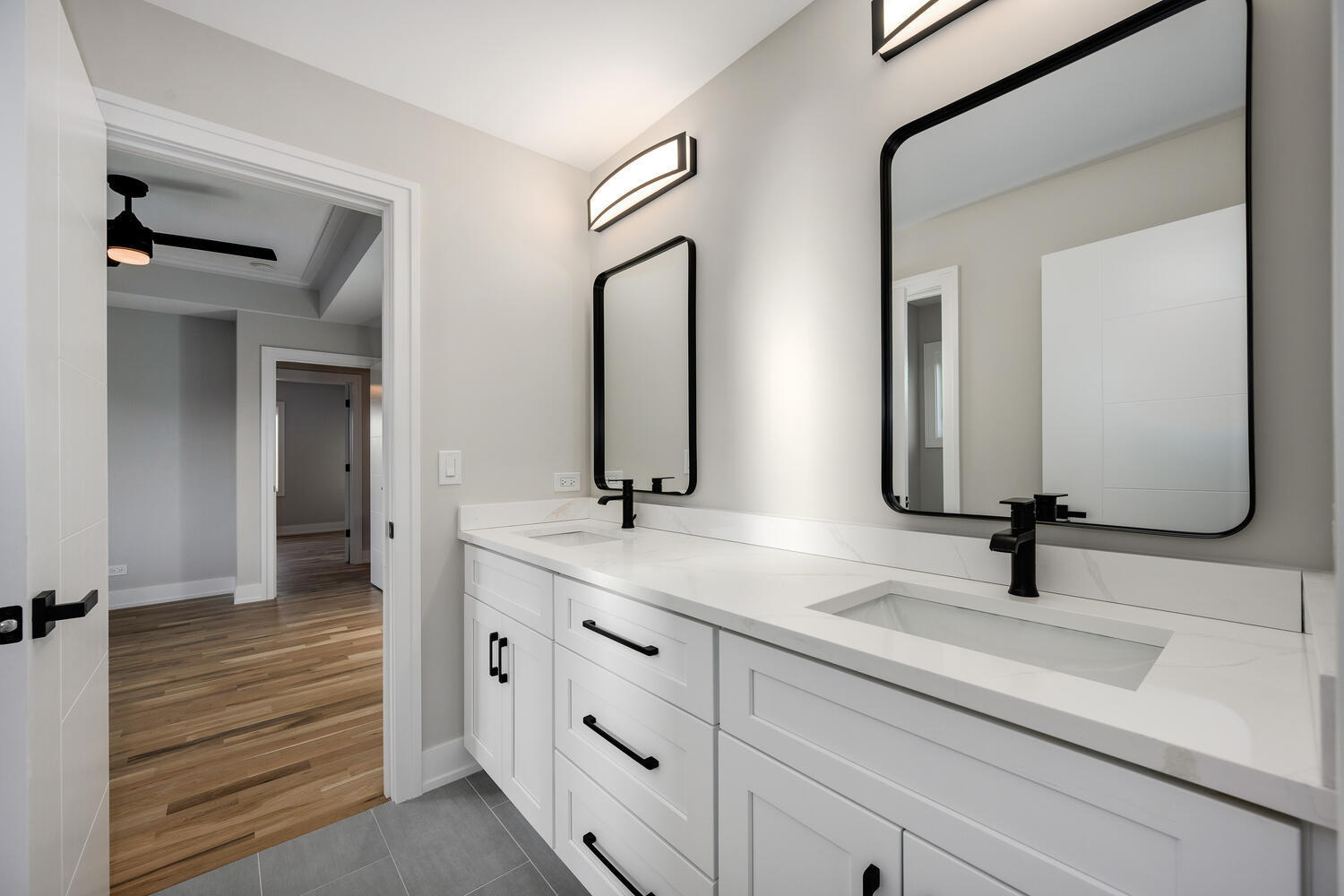 22642 Frontier Court Frankfort, IL 60423 - Photo 24 of 29 a bathroom with double vanity sinks and a mirror