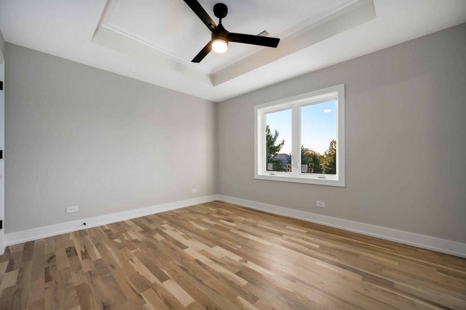 22642 Frontier Court Frankfort, IL 60423 - Photo 26 of 29 a view of empty room with wooden floor and fan