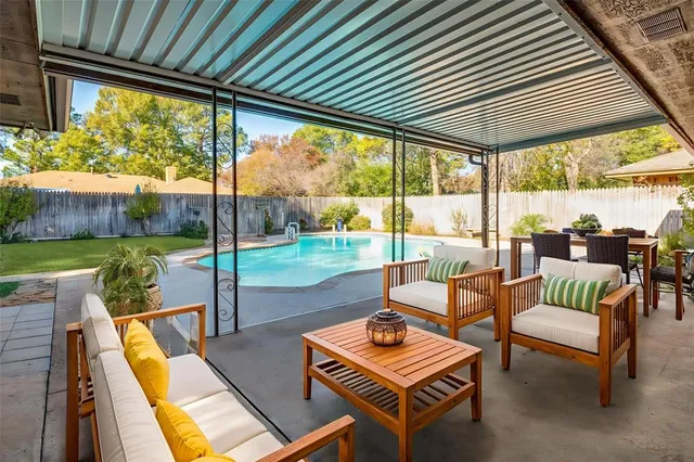 a patio with yard table and chairs