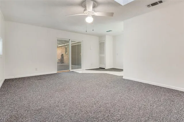 a spacious bathroom with a double vanity sink and a mirror