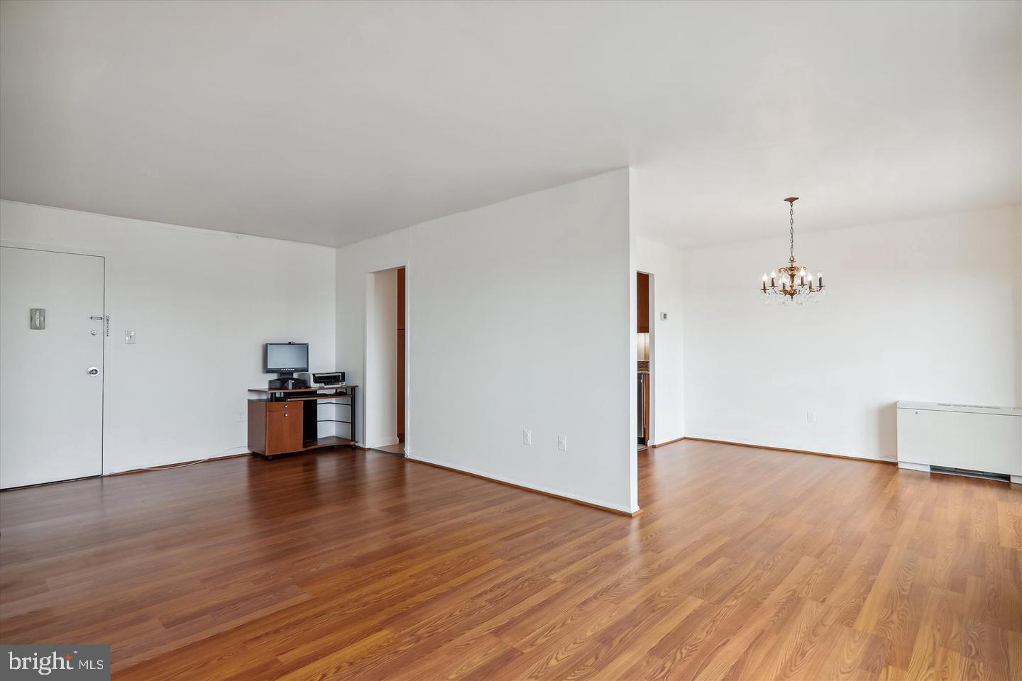 1111 University Boulevard West, Unit 1003 Silver Spring, MD 20902 - Photo 13 of 38 a view of empty room with wooden floor