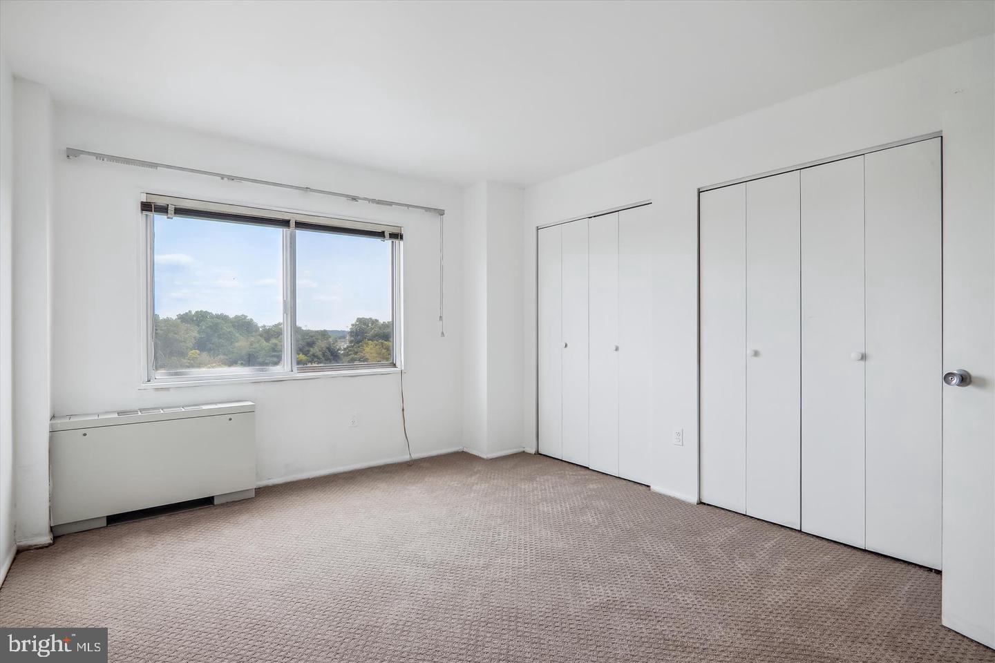 1111 University Boulevard West, Unit 1003 Silver Spring, MD 20902 - Photo 23 of 38 a view of an empty room with a window