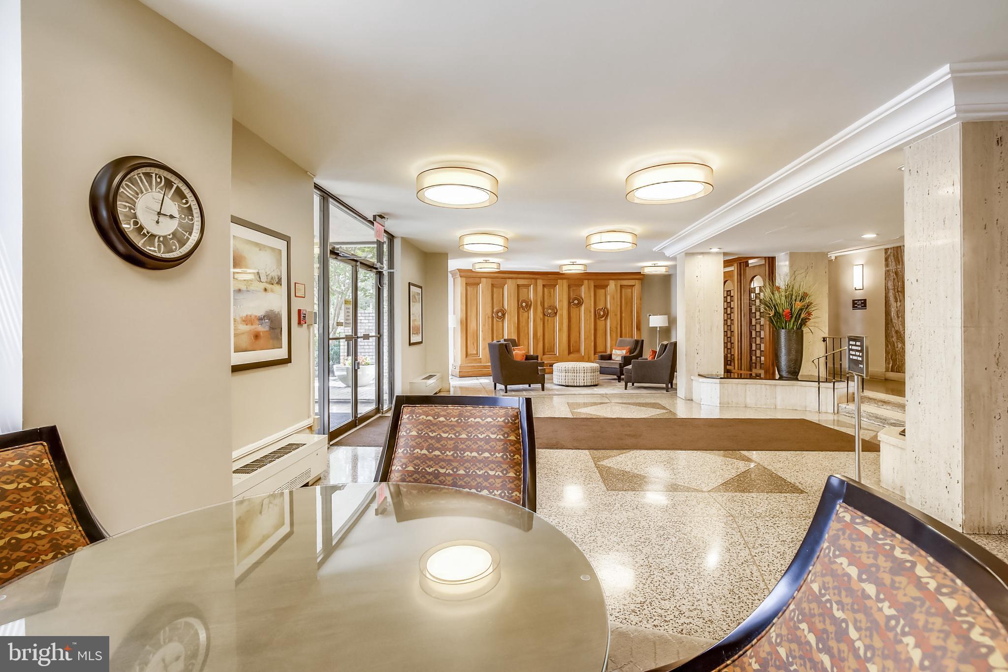 1111 University Boulevard West, Unit 1003 Silver Spring, MD 20902 - Photo 5 of 38 a view of a living room and kitchen