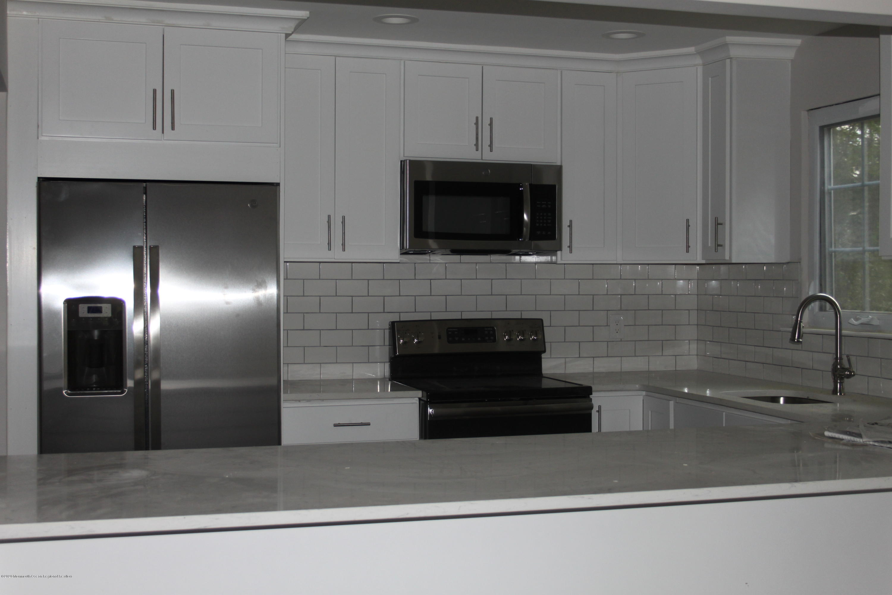 43A Medford Road, Unit B Whiting, NJ 08759 - Photo 1 of 13 a kitchen with a sink and stainless steel appliances