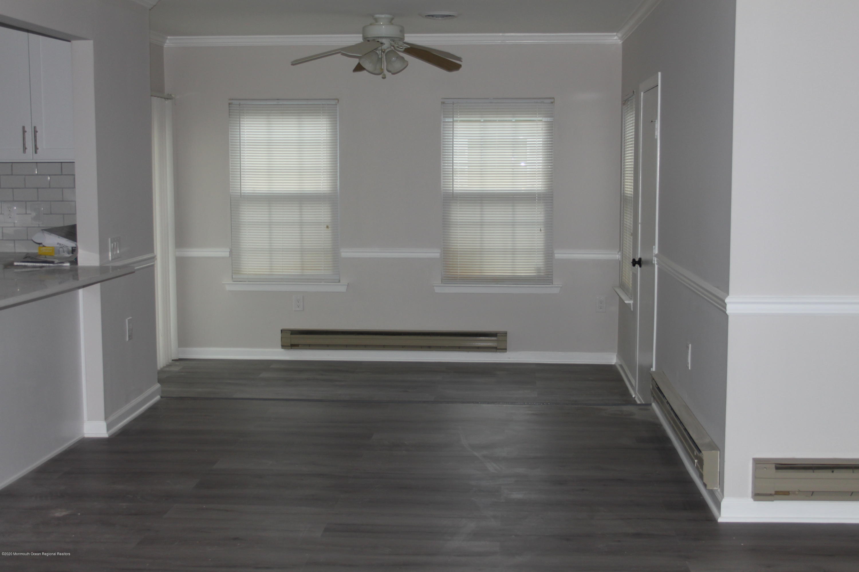 43A Medford Road, Unit B Whiting, NJ 08759 - Photo 2 of 13 an empty room with wooden floor and windows