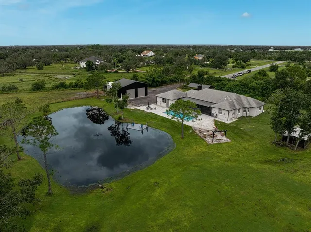 an aerial view of a house with outdoor space