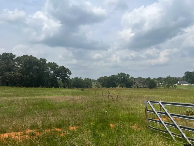 a view of a lake with a big yard