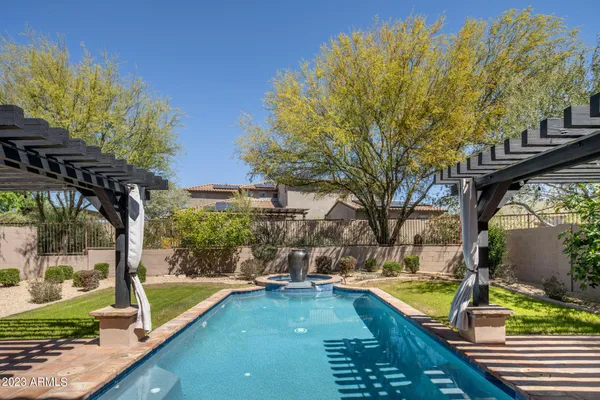 a view of a swimming pool with a patio