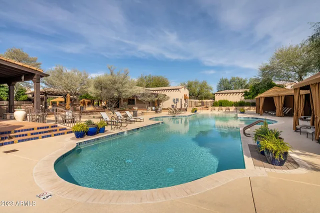 a view of a swimming pool with a patio