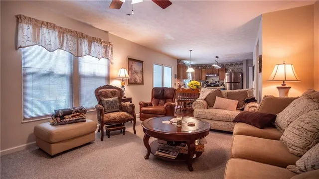 a living room with furniture and a lamp