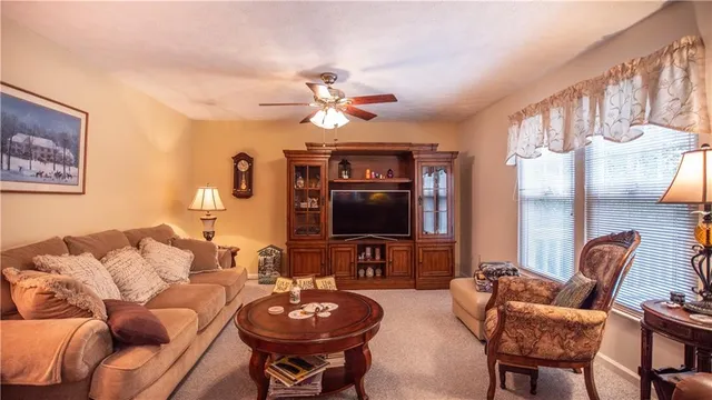 a dining room with furniture and a chandelier