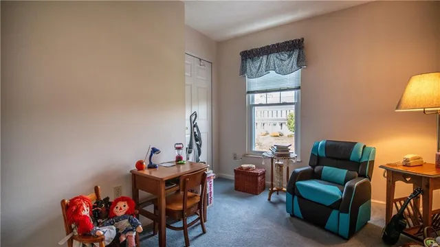 a bathroom with a sink a toilet and shower curtain