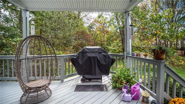 a view of a chairs and table in the balcony