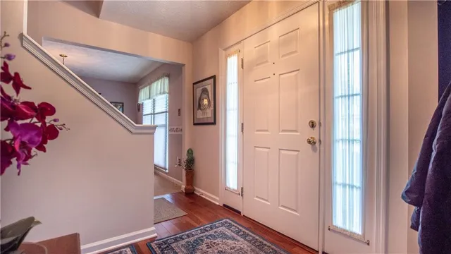a room with bookshelf closet and a couch