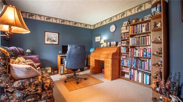 a bed room with a bed and a book shelf