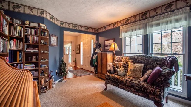 a dining room with furniture and window
