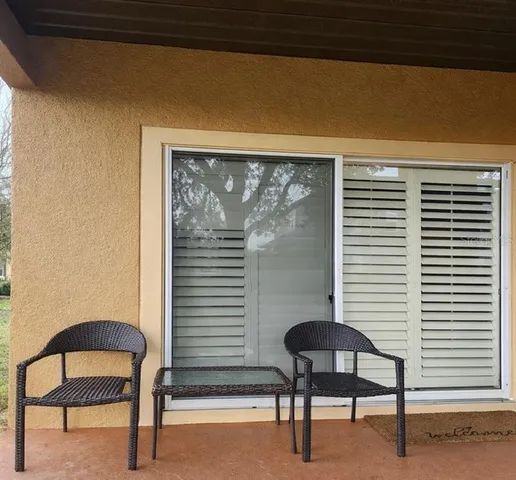 a bedroom with a bed and a chair