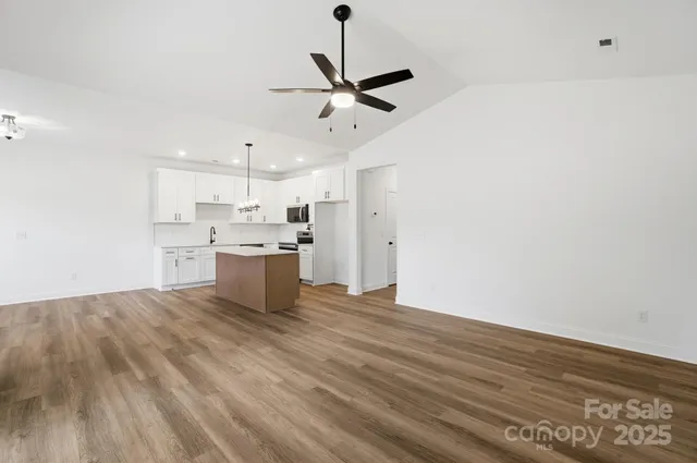 a view of kitchen with wooden floor