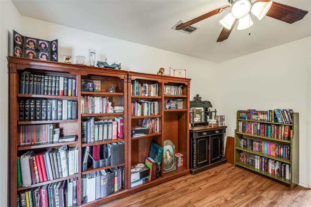 1509 Springbrook Street Corinth, TX 76210 - Photo 11 of 24 a view of a book shelf with lots of books