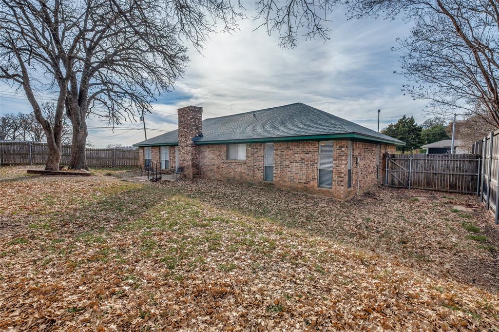 1509 Springbrook Street Corinth, TX 76210 - Photo 23 of 24 a front view of a house with a yard