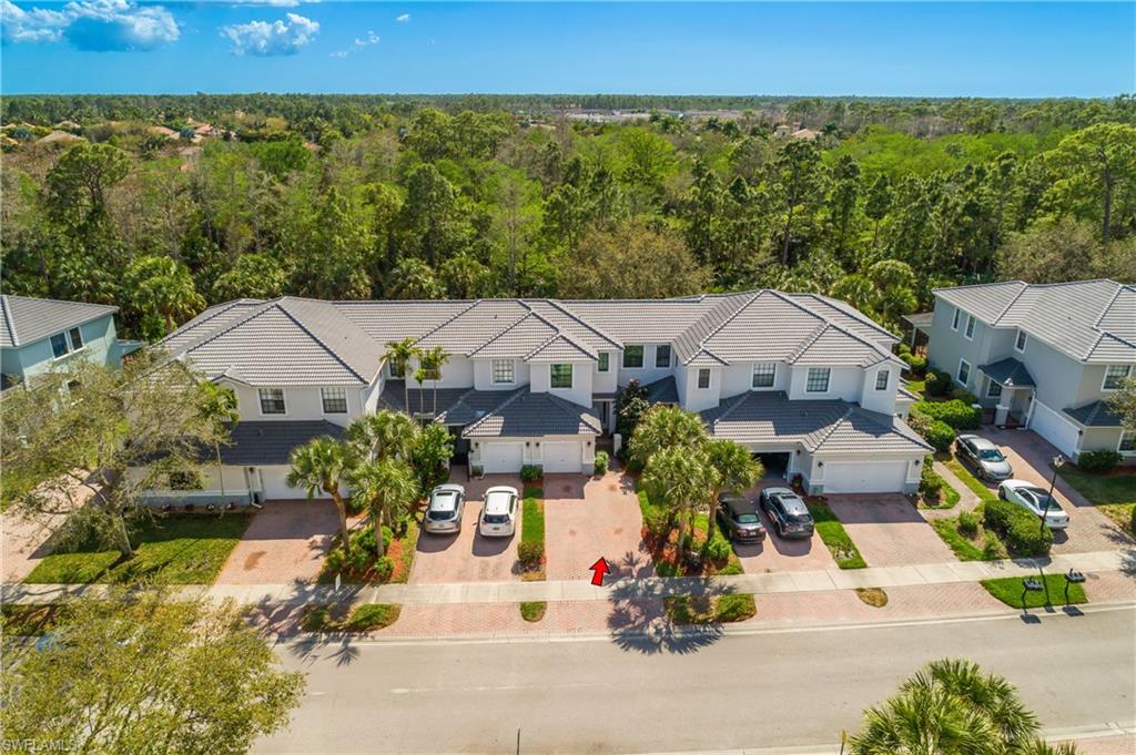 15186 Summit Pl Circle Naples, FL 34119 - Photo 2 of 37 an aerial view of a house with garden