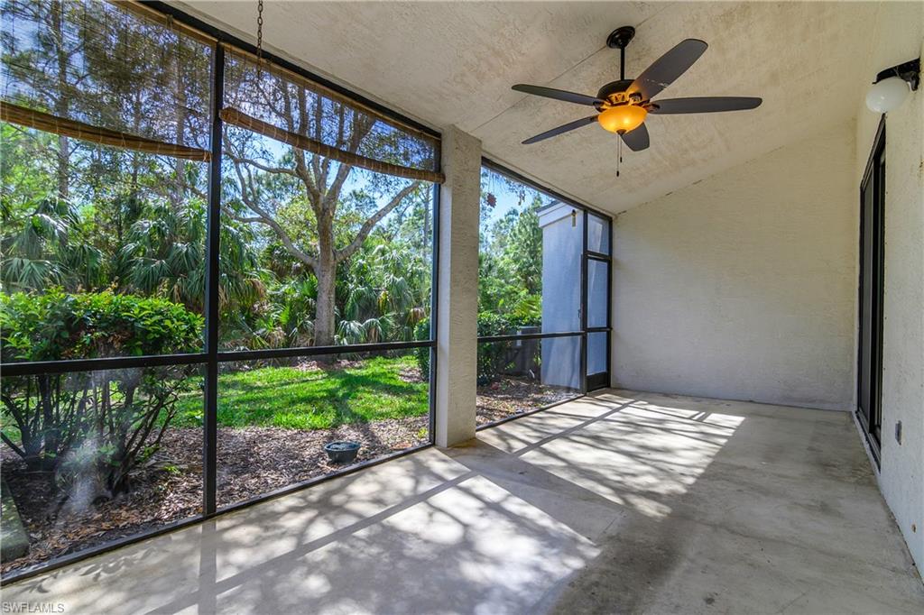 15186 Summit Pl Circle Naples, FL 34119 - Photo 22 of 37 Unfurnished sunroom with ceiling fan and vaulted ceiling