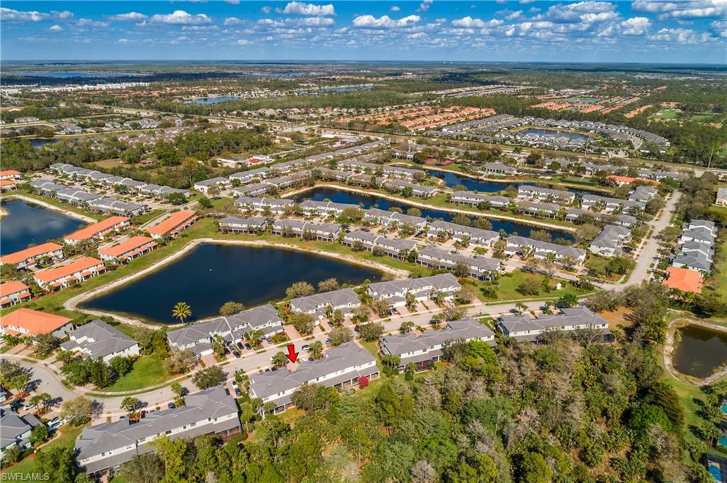 15186 Summit Pl Circle Naples, FL 34119 - Photo 3 of 37 an aerial view of residential houses with outdoor space