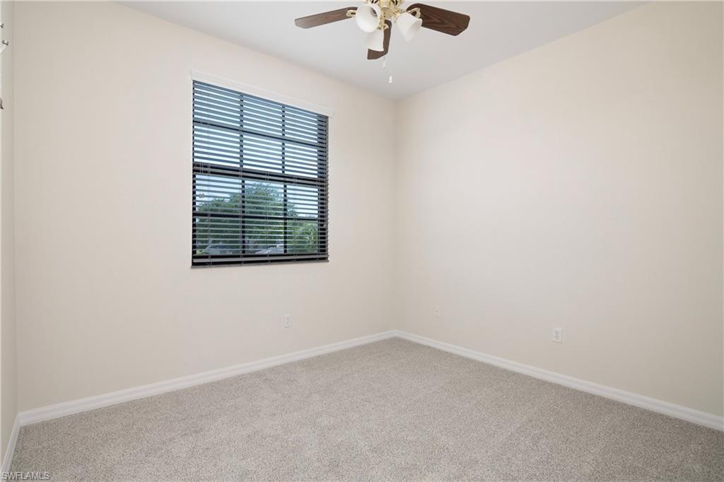 15186 Summit Pl Circle Naples, FL 34119 - Photo 31 of 37 an empty room with a window