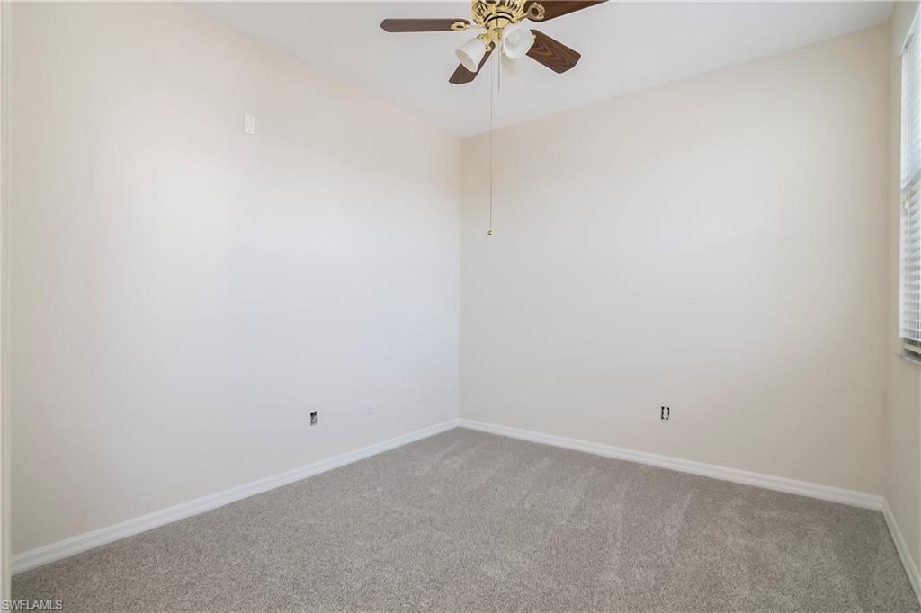 15186 Summit Pl Circle Naples, FL 34119 - Photo 35 of 37 a view of a room with a hanging light