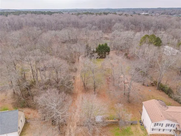 a view of outdoor space with deck and trees