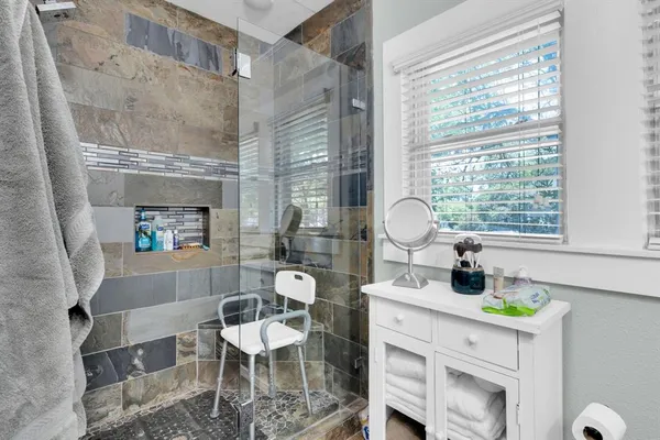 a room with a table chairs and a fireplace