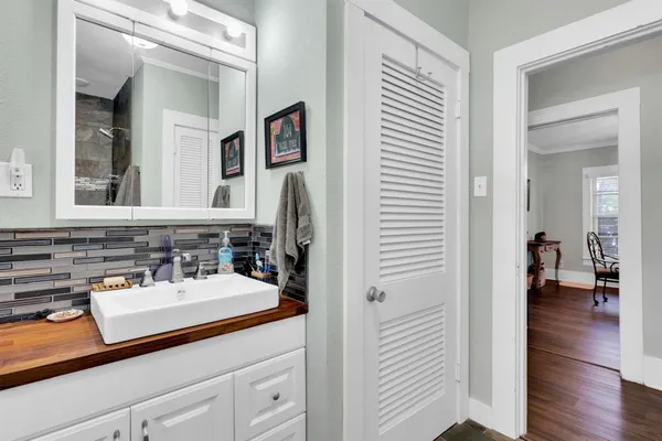 a bathroom with a sink and a mirror