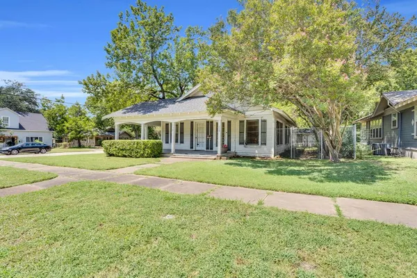 a view of house with a swimming pool