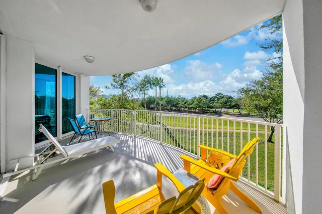 a view of a swimming pool with a yard