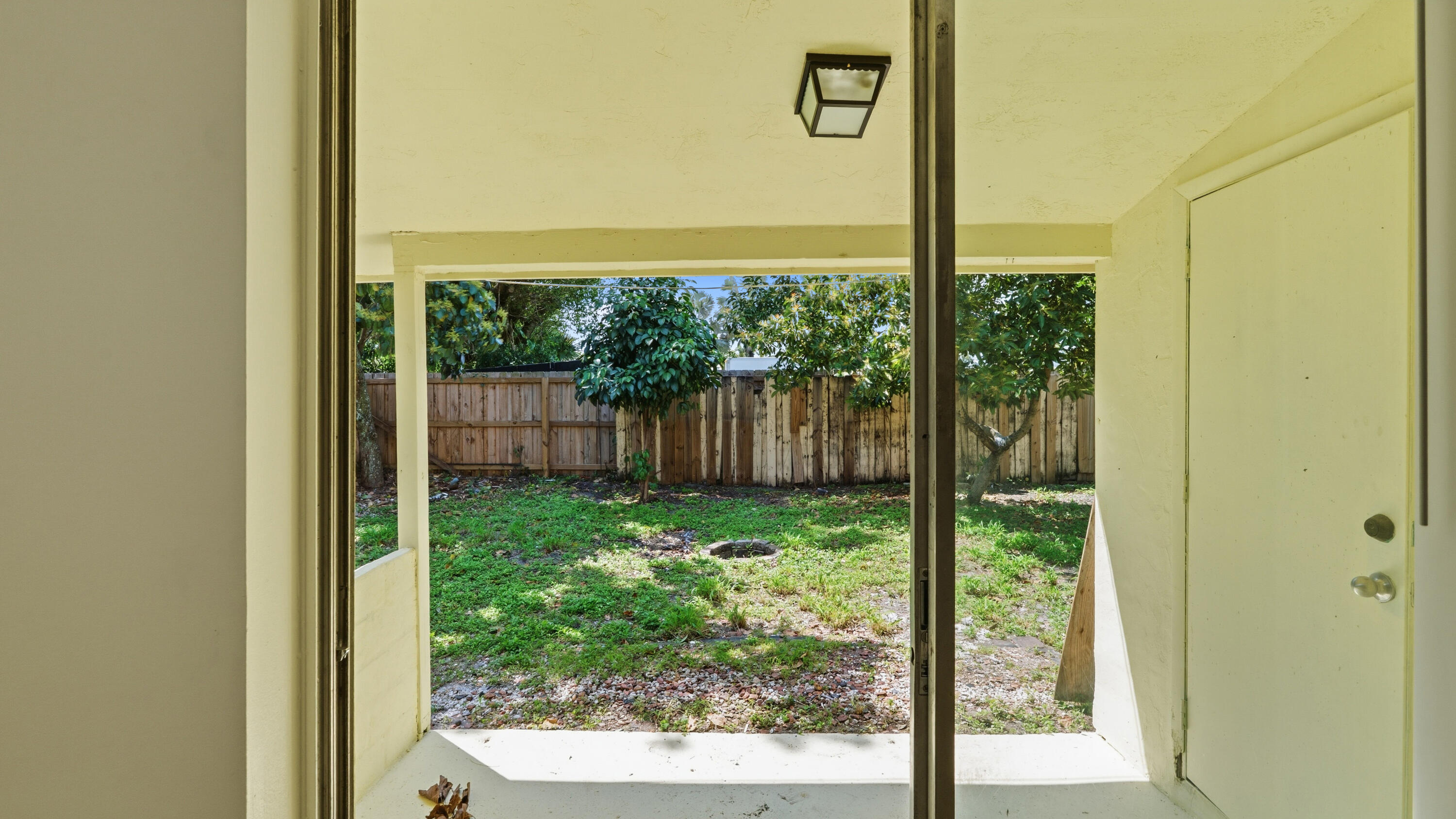 4453 Stevens Road Lake Worth Beach, FL 33461 - Photo 56 of 67 a view of a back yard from a room