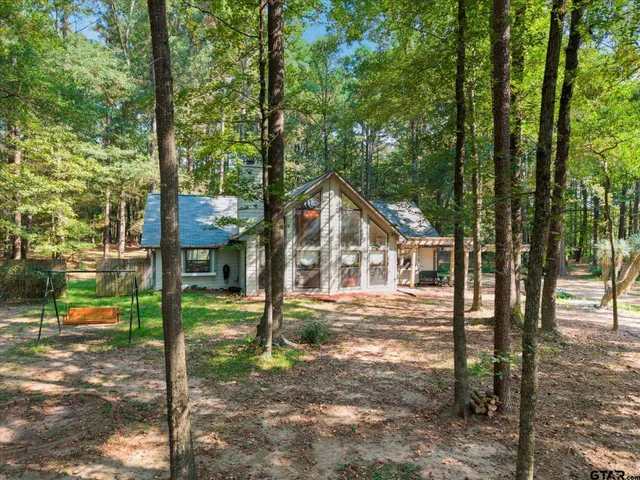 a house view with a backyard space