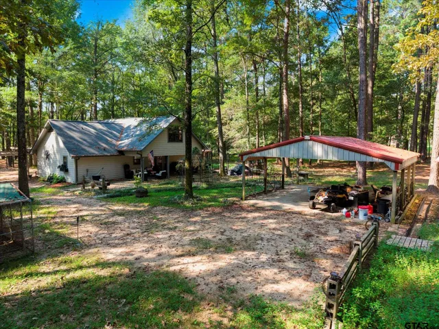 a view of a big house with a yard