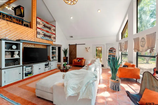 a living room with furniture and a flat screen tv