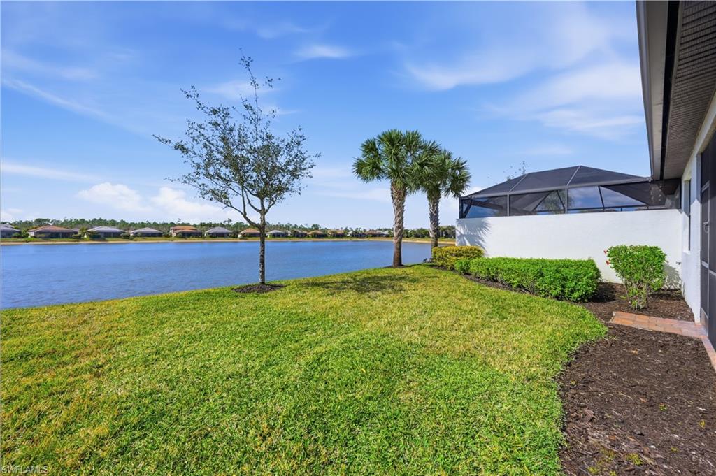 7733 Jacaranda Lane Naples, FL 34114 - Photo 24 of 38 a view of a garden with a house