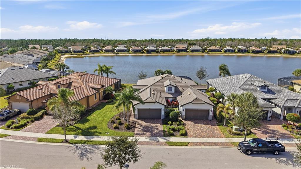 7733 Jacaranda Lane Naples, FL 34114 - Photo 27 of 38 an aerial view of a house with a lake view