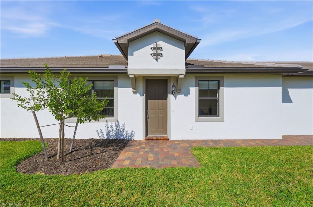 7733 Jacaranda Lane Naples, FL 34114 - Photo 3 of 38 a view of outdoor space yard and front view of a house