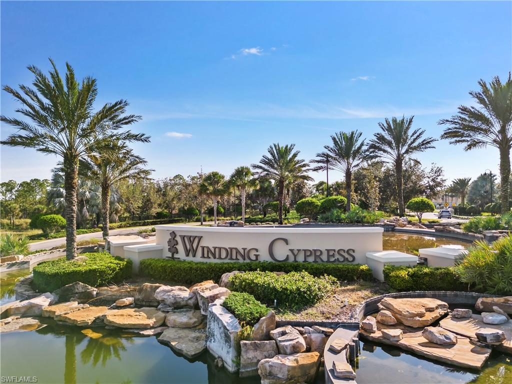 7733 Jacaranda Lane Naples, FL 34114 - Photo 31 of 38 a view of swimming pool with outdoor seating and green space