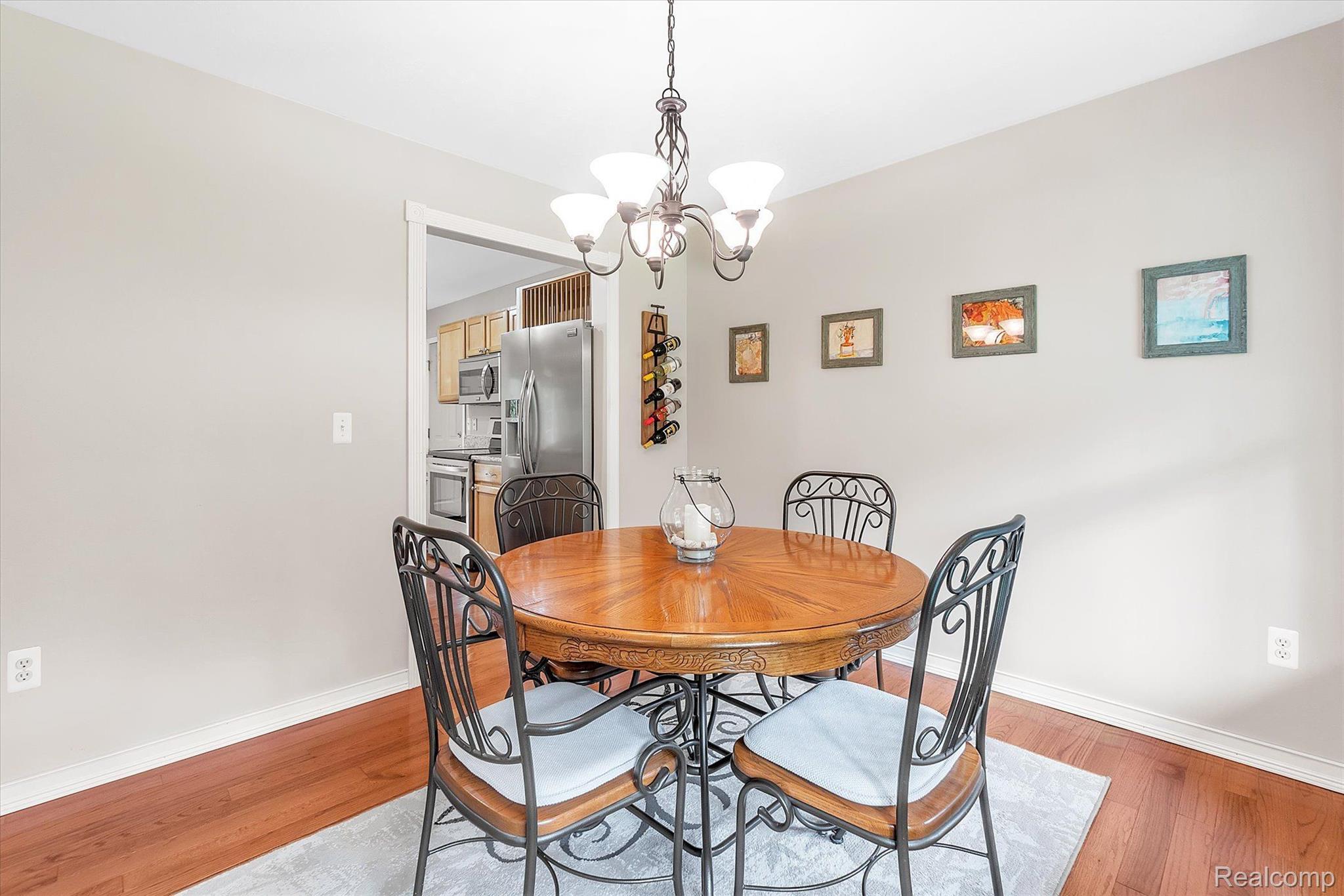 9236 West Lamoreaux Road Fowlerville, MI 48836 - Photo 7 of 40 Dining Room with Hardwood Floors