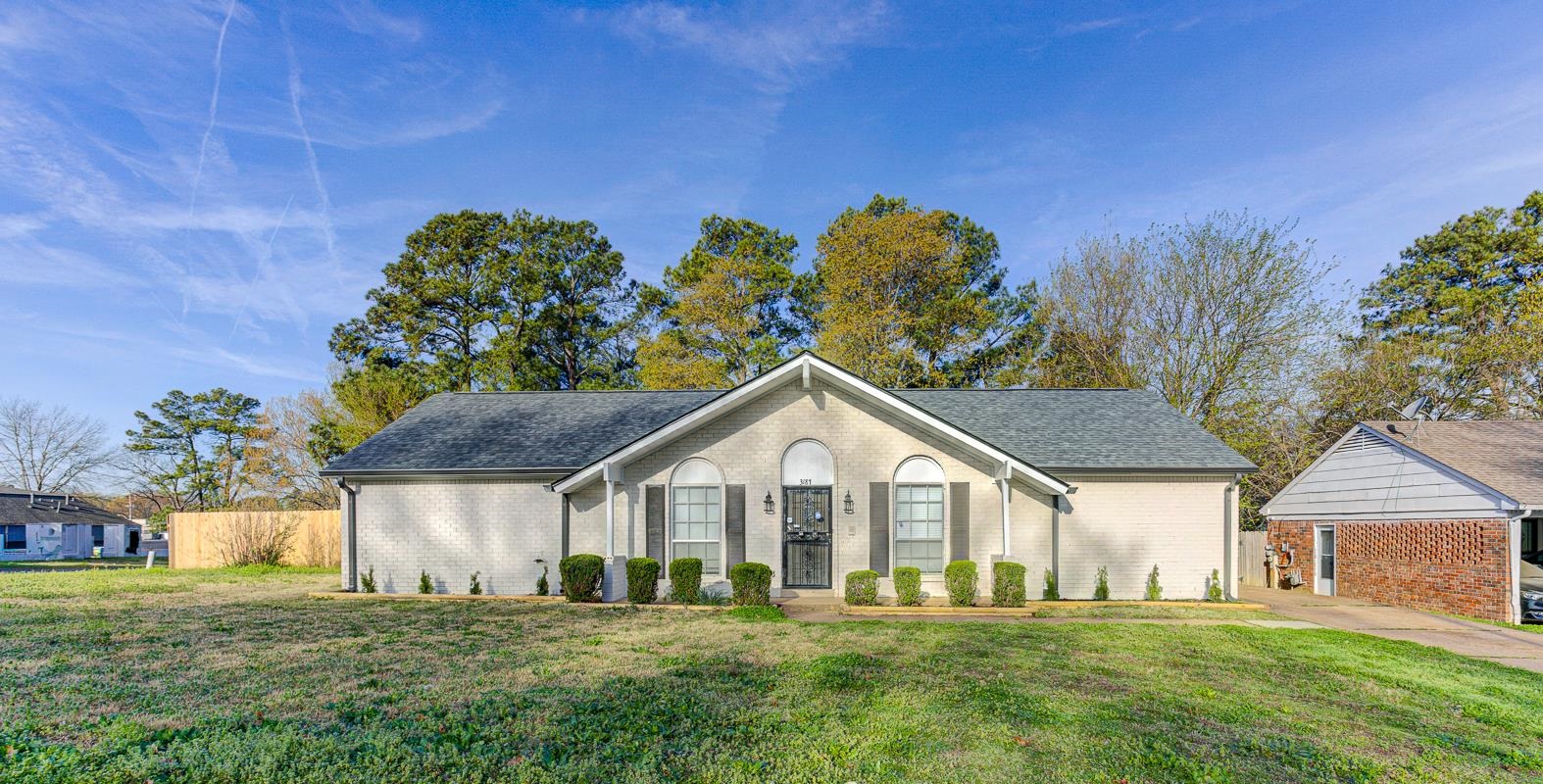 a front view of a house with a yard