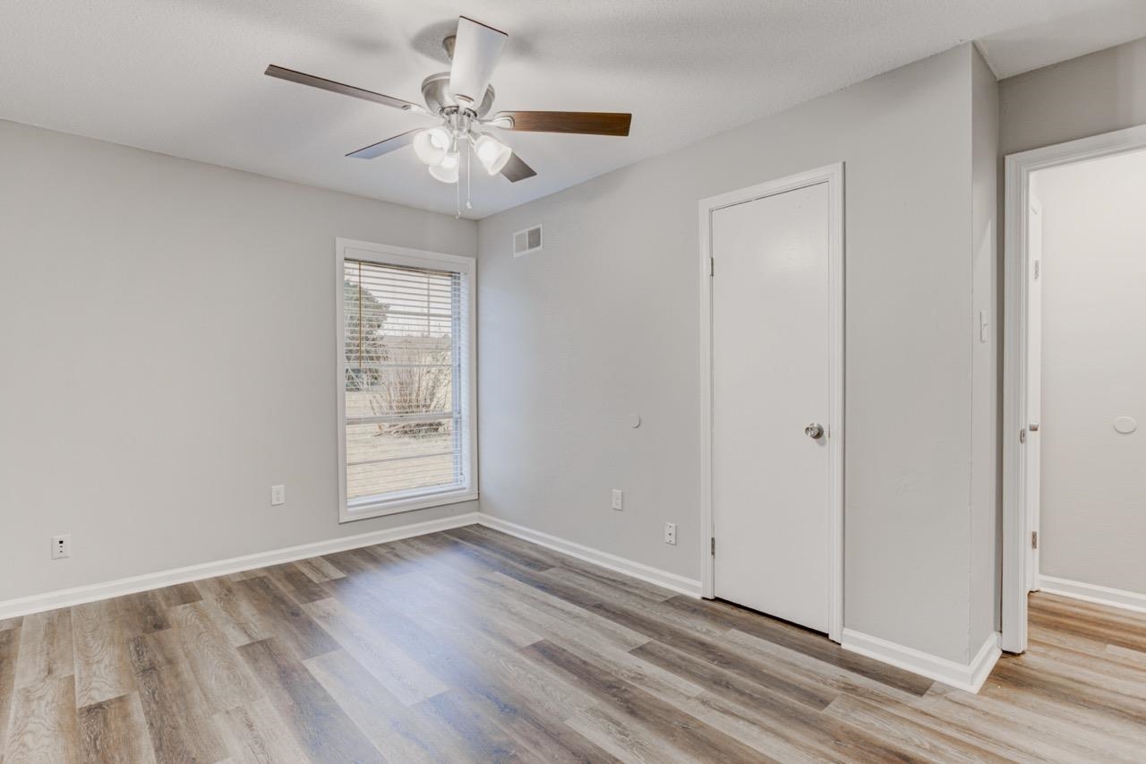 3187 Belle Tower Road Memphis, TN 38115 - Photo 18 of 24 Unfurnished bedroom with light wood-type flooring and ceiling fan