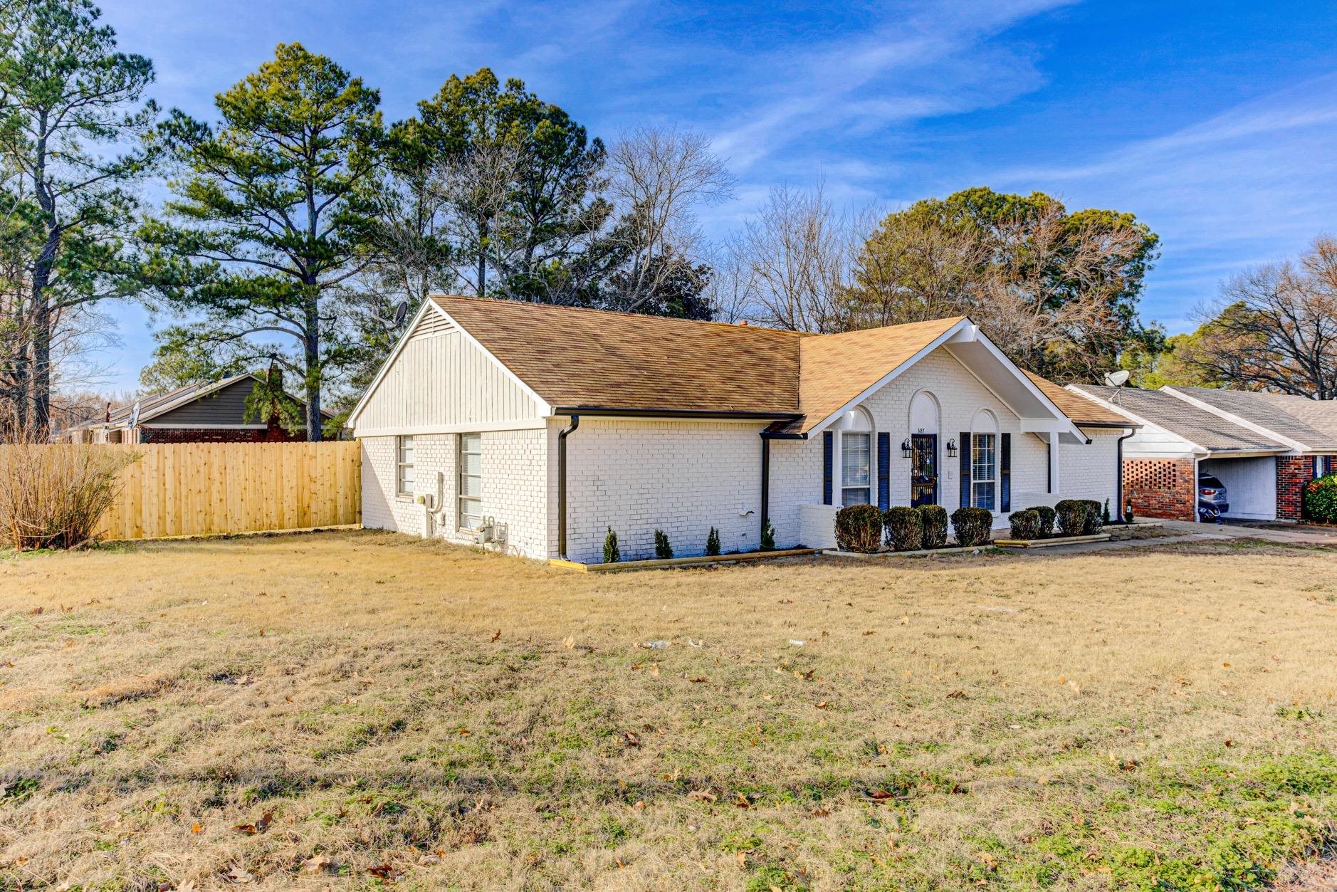 3187 Belle Tower Road Memphis, TN 38115 - Photo 3 of 24 Single story home featuring brick siding and a shingled roof