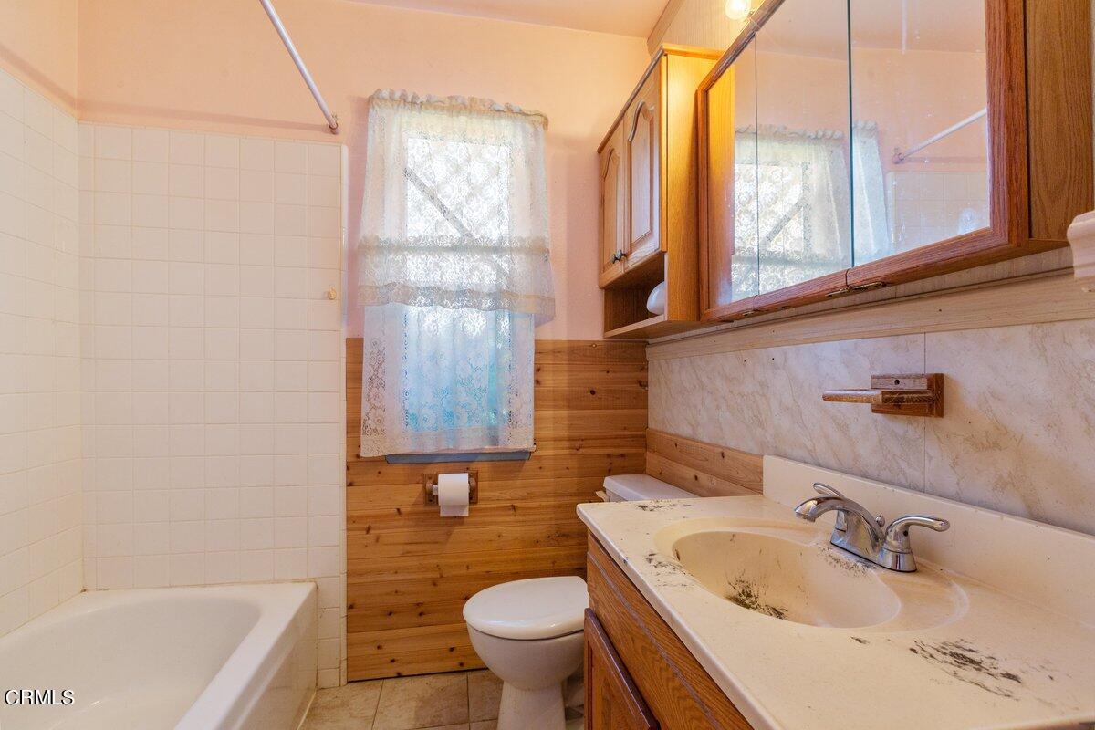 1931 Ukiah Street Oxnard, CA 93035 - Photo 16 of 21 a bathroom with a sink and a toilet