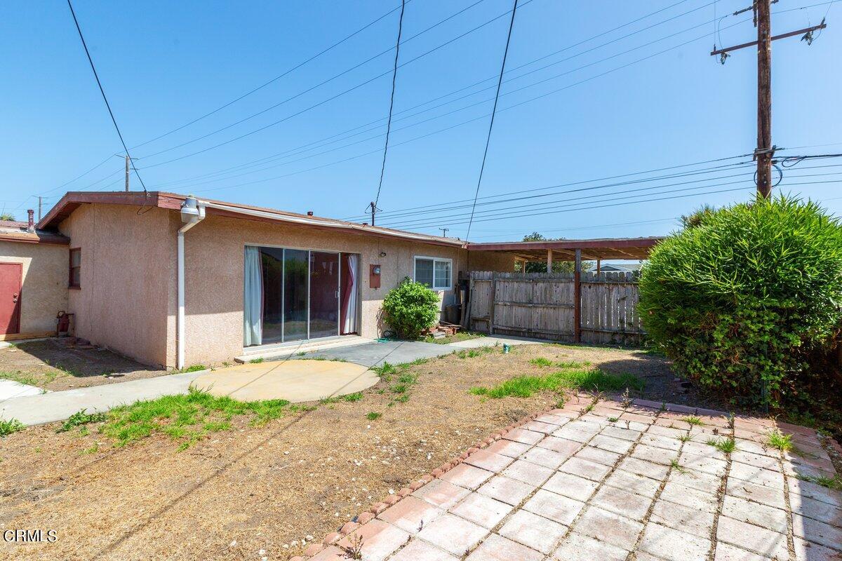 1931 Ukiah Street Oxnard, CA 93035 - Photo 19 of 21 a front view of a house with a yard and garage