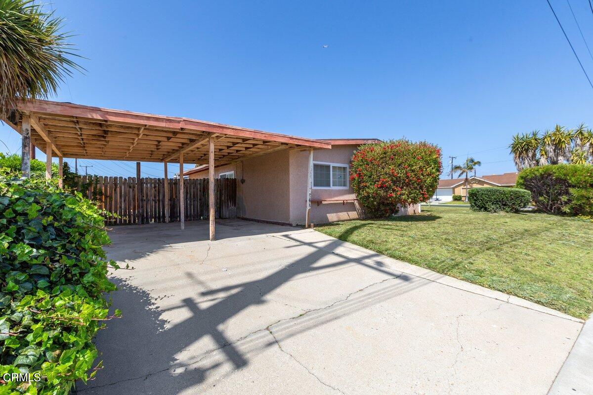 1931 Ukiah Street Oxnard, CA 93035 - Photo 21 of 21 a patio with a table and chairs under an umbrella