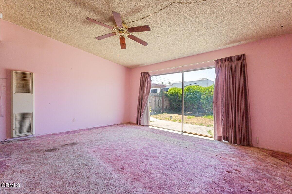 1931 Ukiah Street Oxnard, CA 93035 - Photo 3 of 21 an empty room with ceiling fan and windows